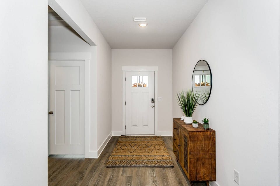 Spacious entry with neutral and cozy decor