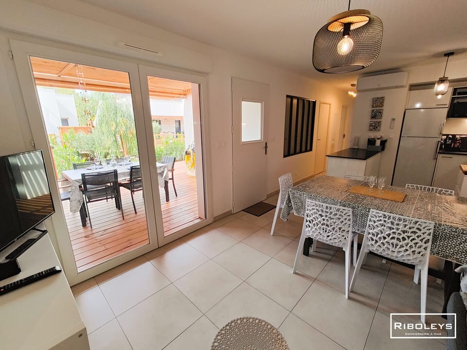 Air-conditioned living room opening onto terrace