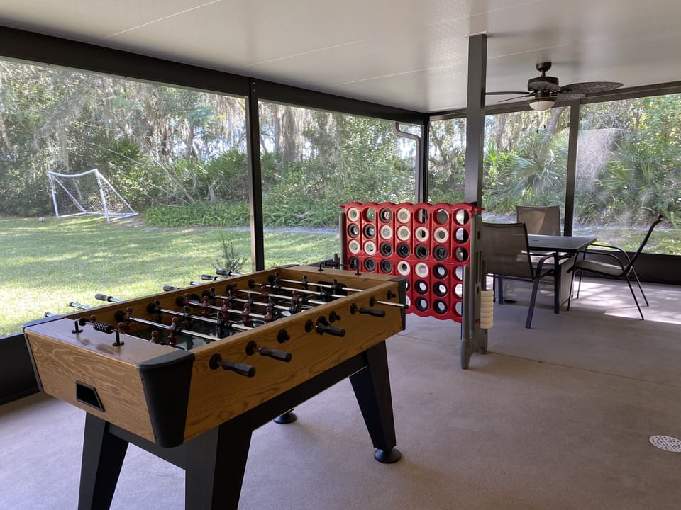 Seating area with Games in screened in porch