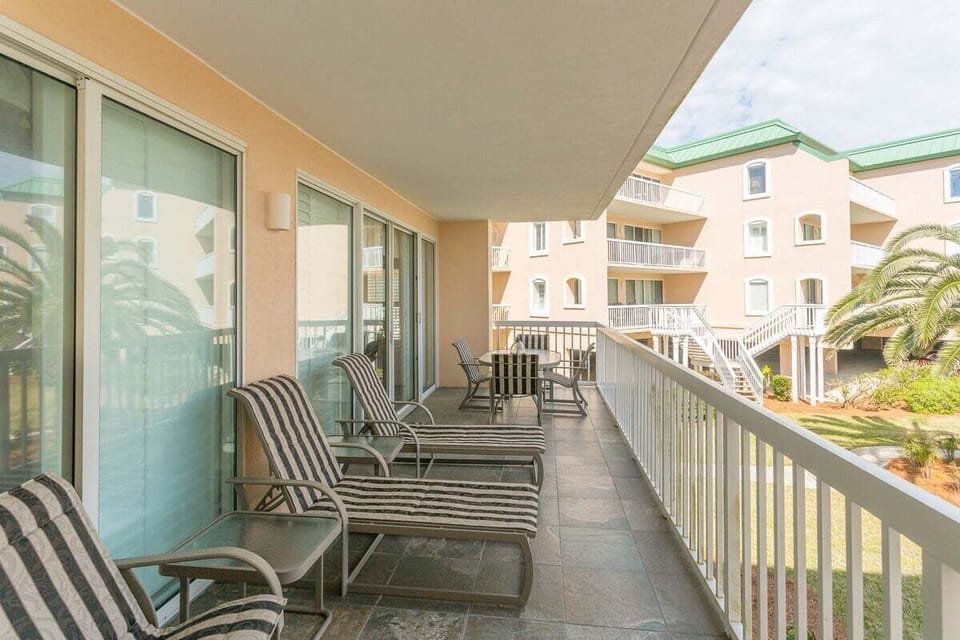 Saint Simons Grand #107 balcony with chairs and reclining lounge set