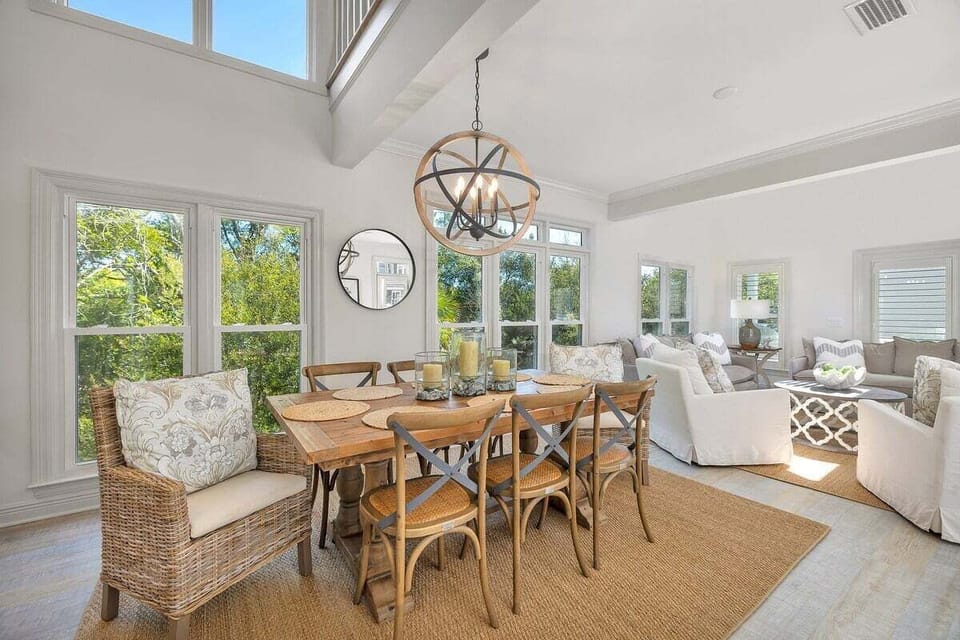 Dining table with seating for eight and side view of the living area