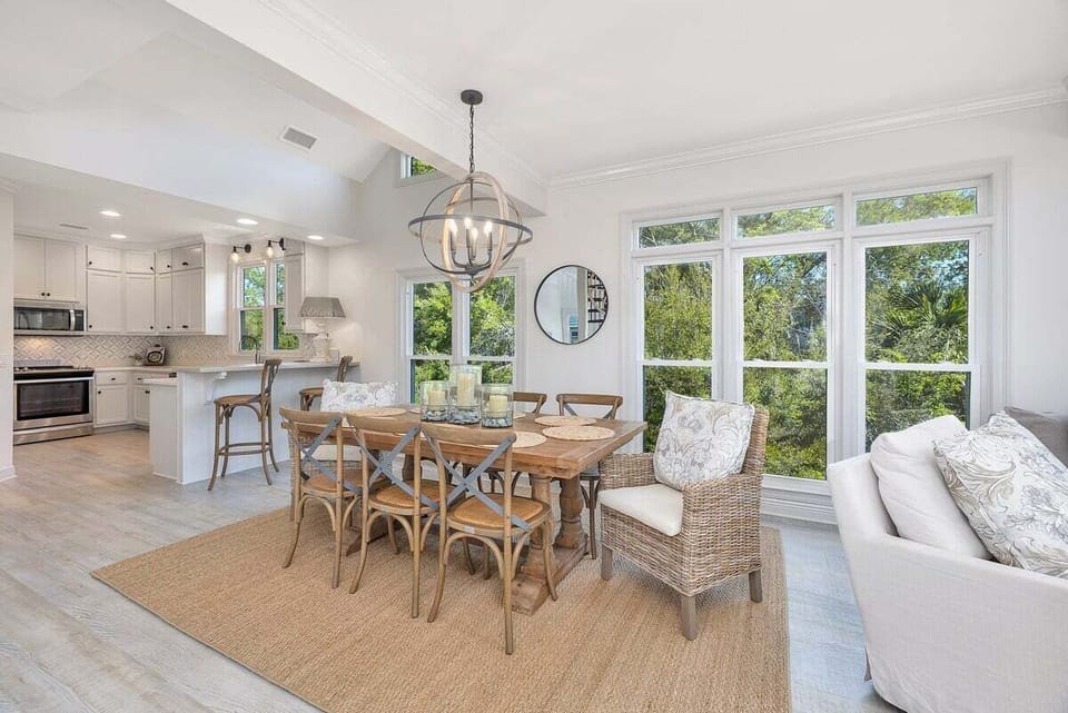Open-concept kitchen, dining, and living area with modern decor