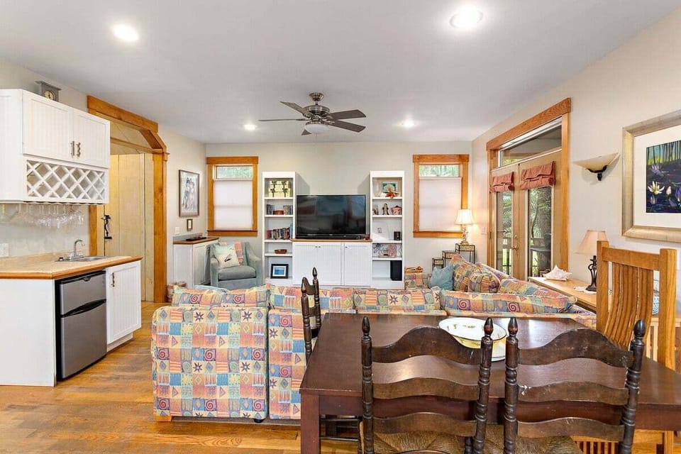 Open living area with colorful sofas and built-in bar