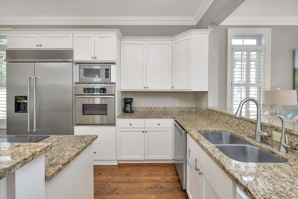 Modern kitchen with stainless steel appliances and granite countertops