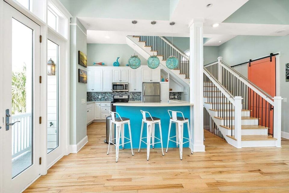 Alternate view of open-concept kitchen with access to the staircase
