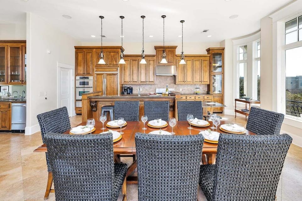 Formal dining room with wood table and kitchen view