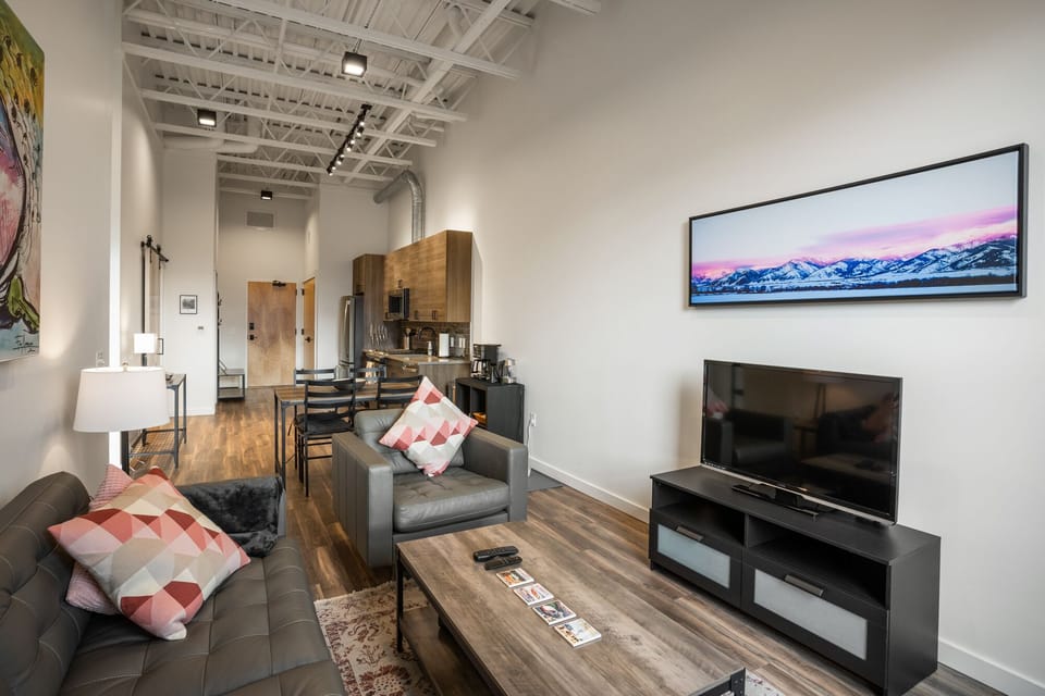 Open concept living, dining and kitchen areas.
