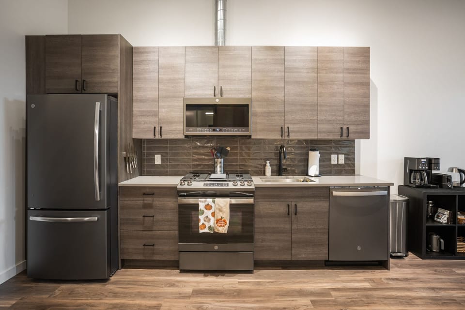Full kitchen with drip coffee machine.