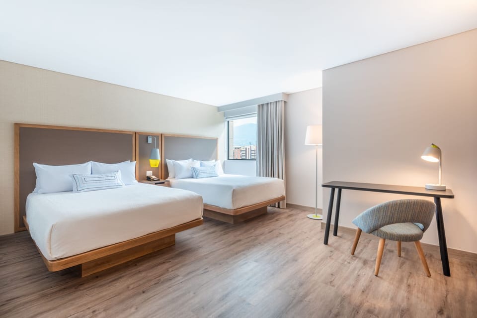Standard Double Room, 2 Queen Beds | In-room safe, desk, laptop workspace, blackout drapes