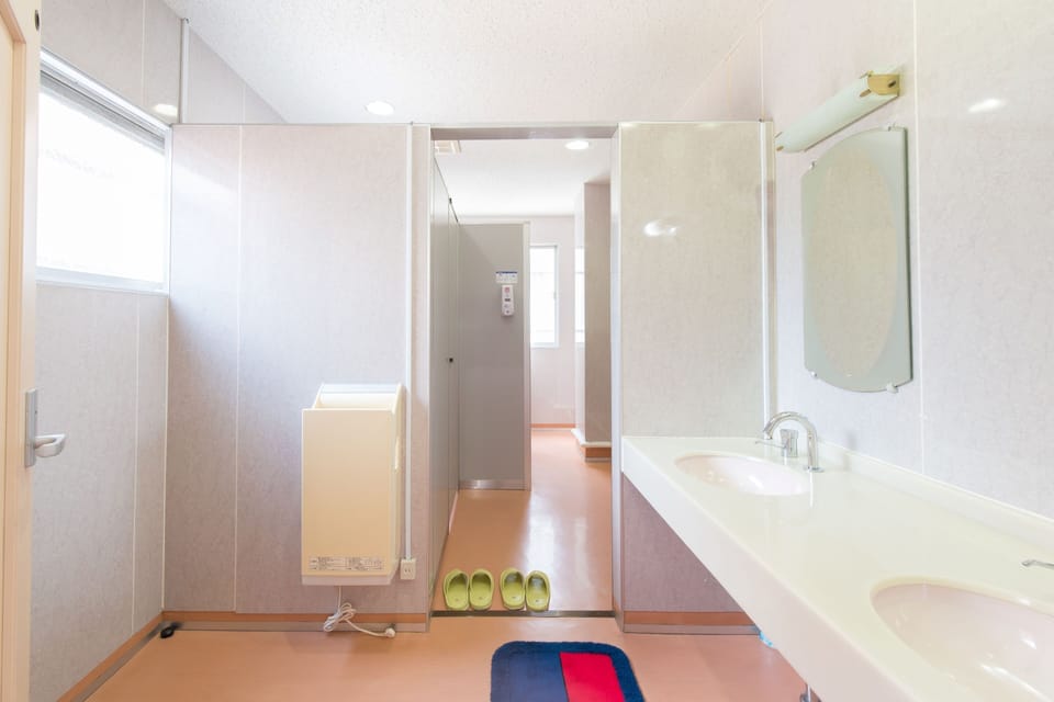 Separate tub and shower, deep soaking tub, slippers, towels