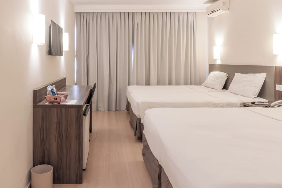 Deluxe Quadruple Room | Minibar, in-room safe, desk, free WiFi