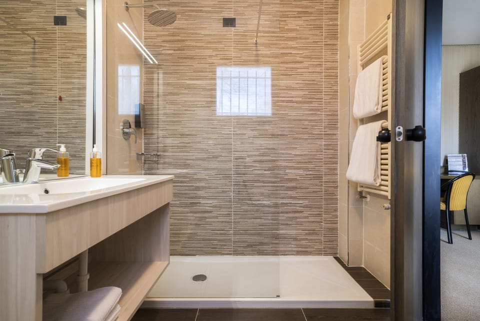 Shower, free toiletries, hair dryer, slippers