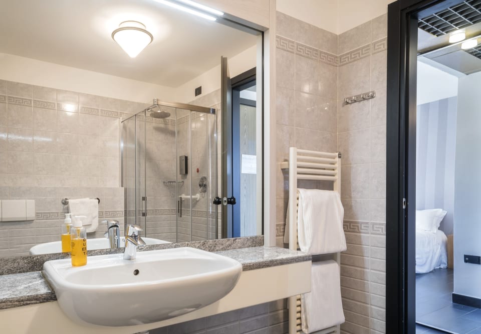 Shower, free toiletries, hair dryer, slippers