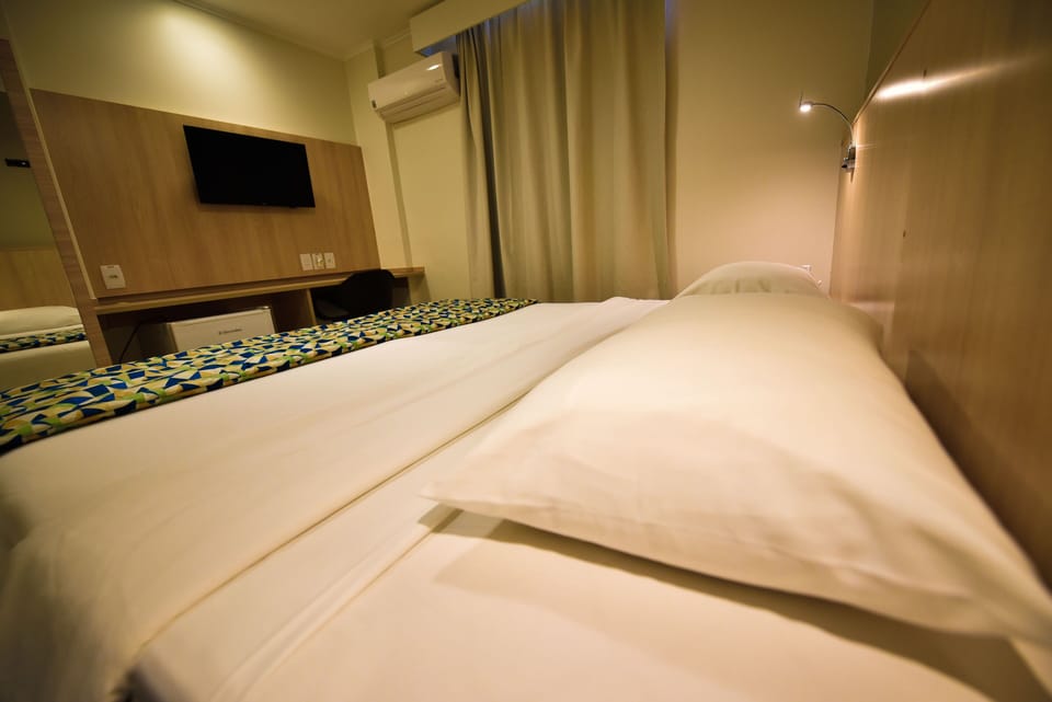 Standard Double or Twin Room | Minibar, in-room safe, desk, laptop workspace