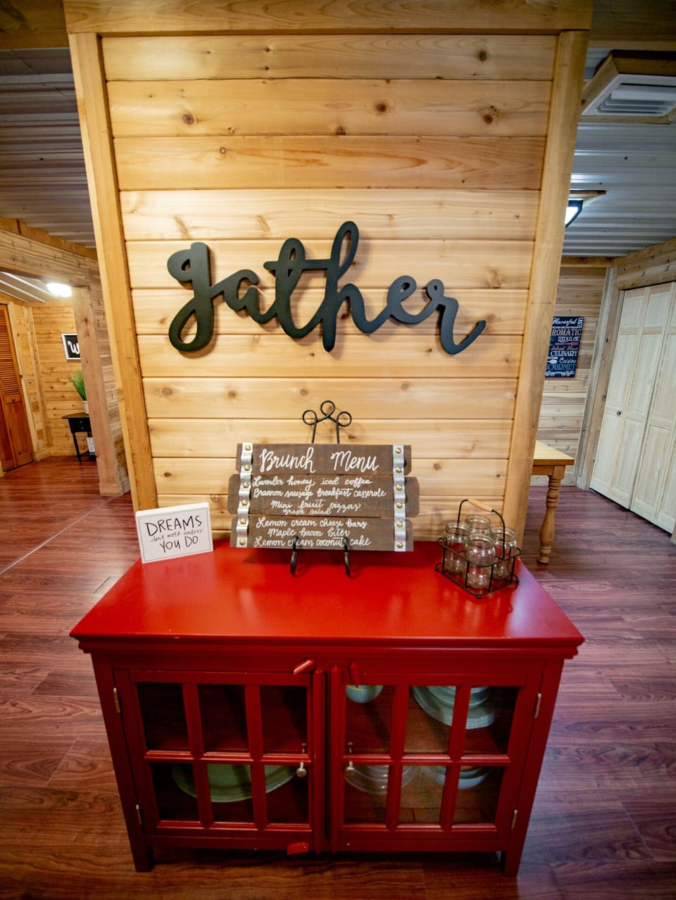 Dinner plates and bowls stored here in red cabinet.