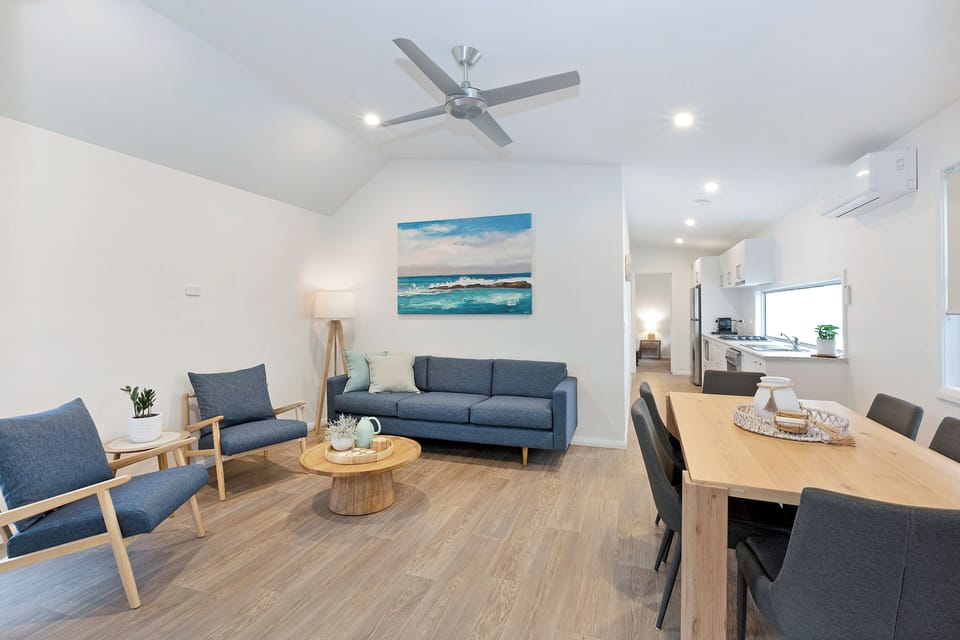 Premium Cabin - Sleeps 6 | Living area | Flat-screen TV, DVD player