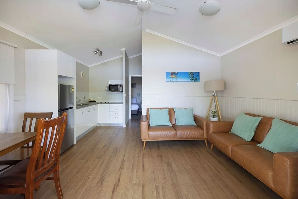 Superior Cabin - Sleeps 4 | Living area | 32-inch TV with digital channels