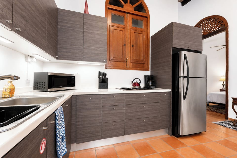 Alternate kitchen angle showing well equipped setup, perfect for meals at home.