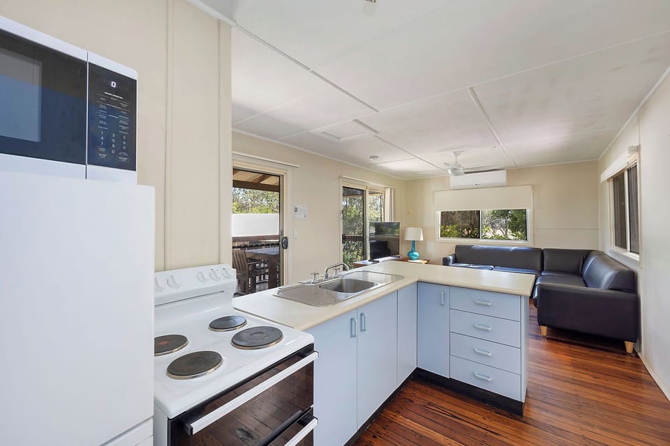 Deluxe Cabin - Sleeps 4 - Dog Friendly | Private kitchen | Full-size fridge, microwave, stovetop, electric kettle