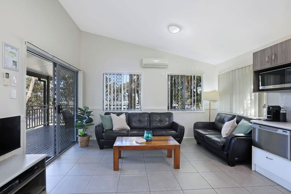 Premium Cabin - Sleeps 5 | Living area | LCD TV, DVD player
