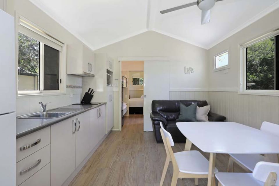 Standard Cabin - Sleeps 4 | Living area | 32-inch flat-screen TV with cable channels, LCD TV