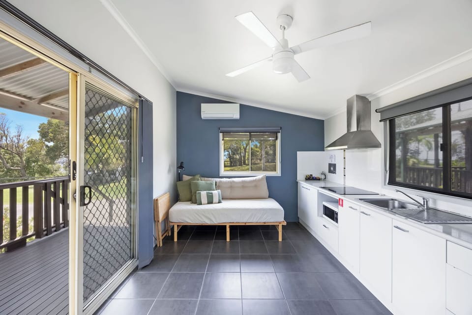 Standard Cabin - Sleeps 4 | Living area | LCD TV, pay movies
