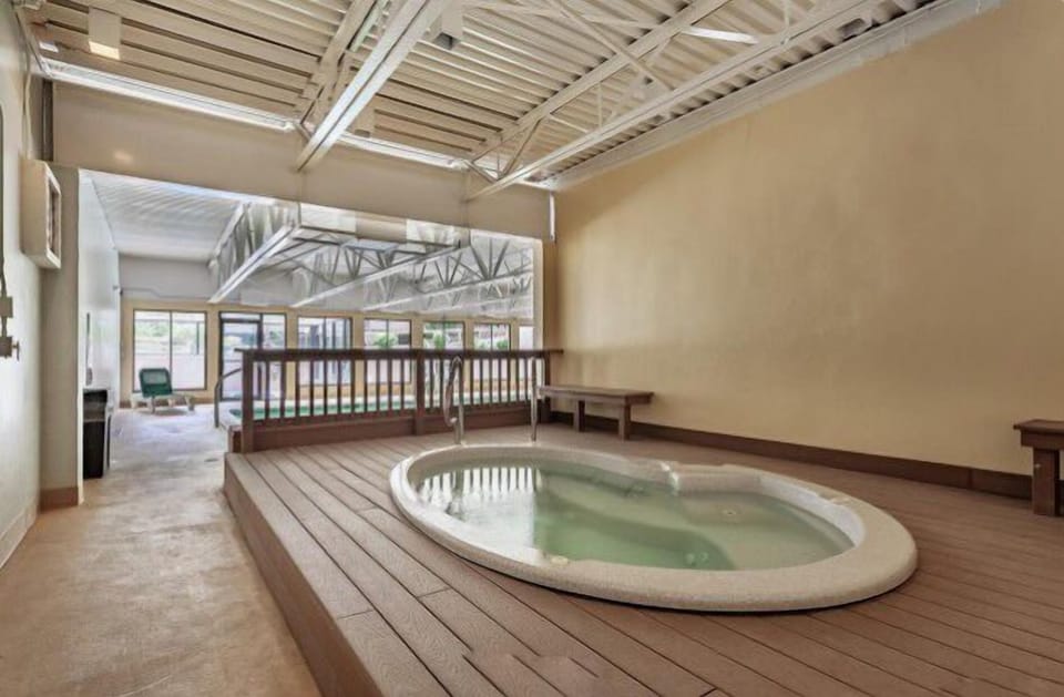 The clubhouse spa awaits with this soothing indoor hot tub, where you can unwind under the elegant exposed ceiling after a day of exploring.
