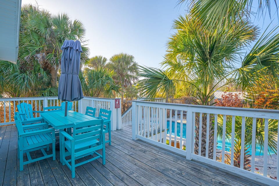 2nd floor patio deck off kitchen and 2nd bedroom.  Private pool in background.