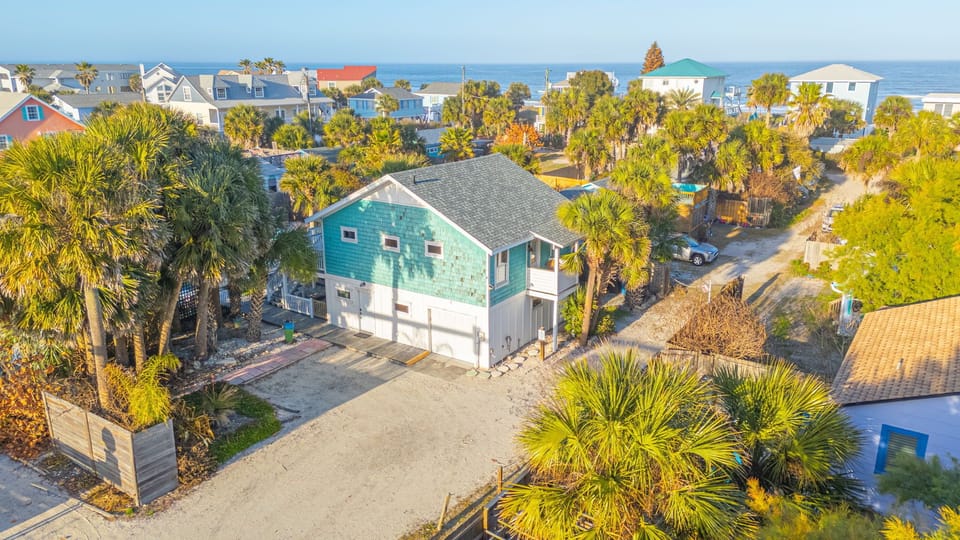 Looking at property facing east, 2 of 4 parking spots and proximity to ocean.