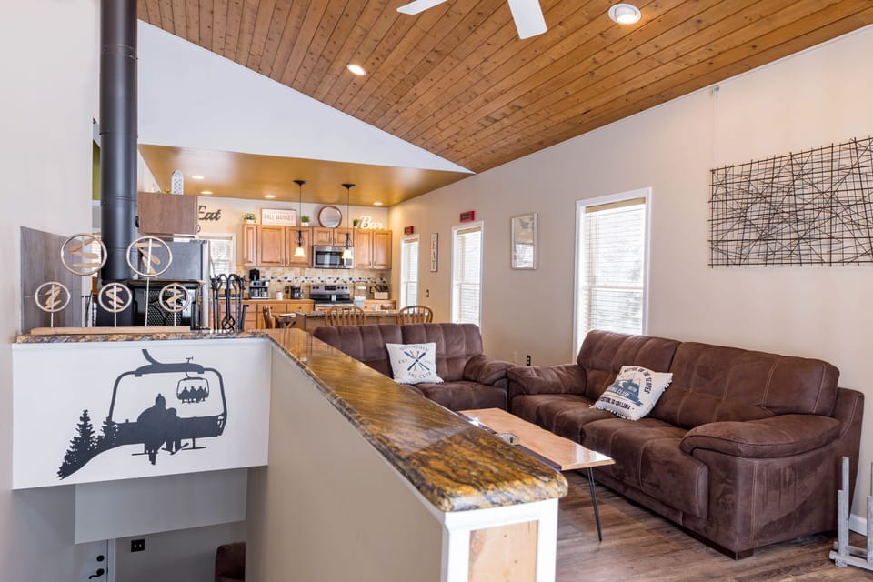 Living Room Kitchen View.  75" TV on wall as well.  