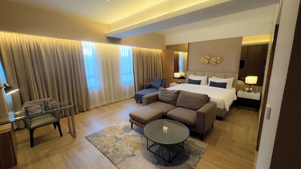 Ambassador Suite Room | Minibar, in-room safe, desk, laptop workspace