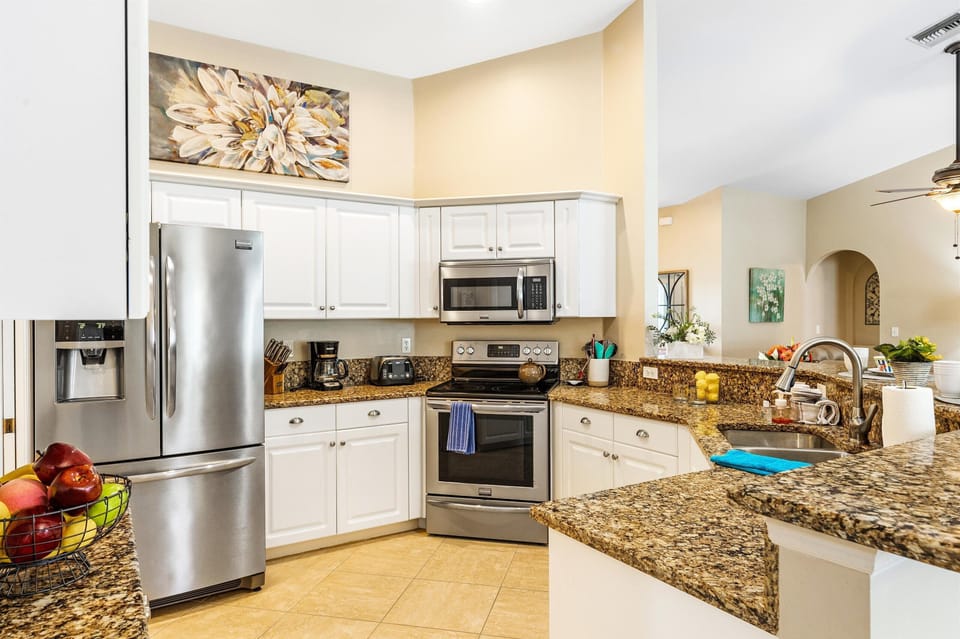 The fully equipped-kitchen has stainless steel appliances