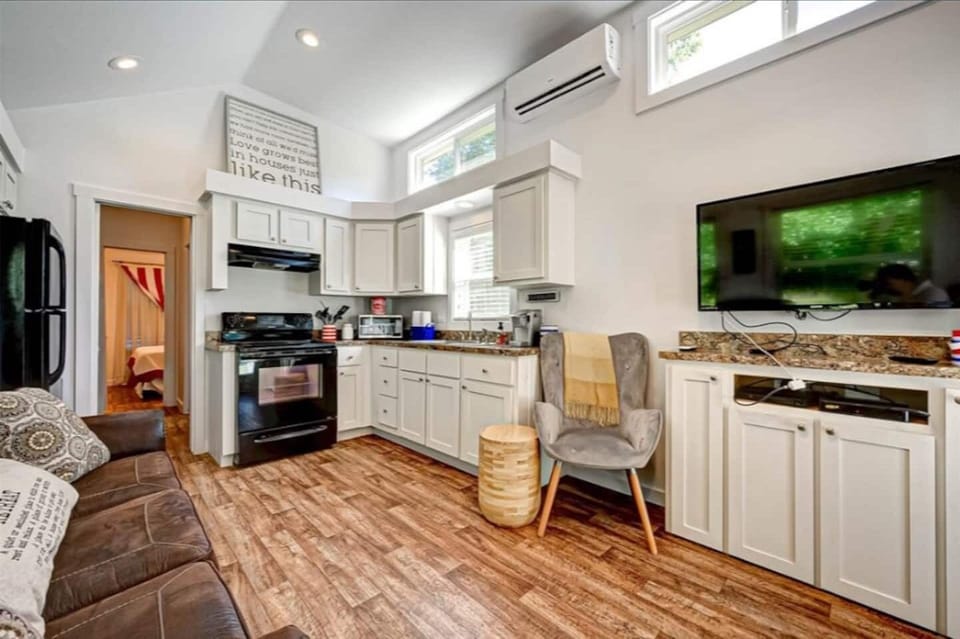 Alternate view of the Living Room / Kitchen, showing TV