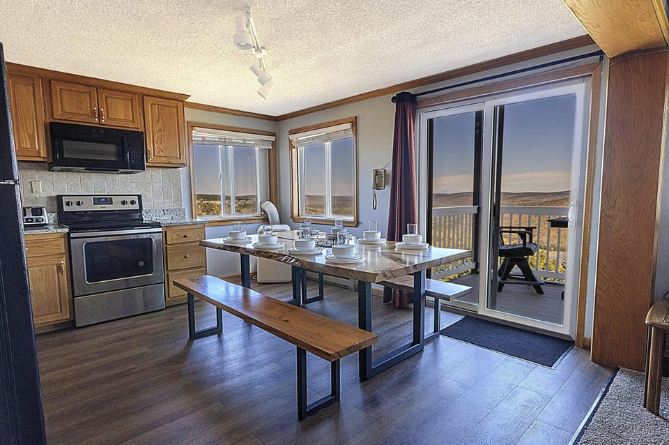 Enjoy shared meals and great conversations at the spacious kitchen table.