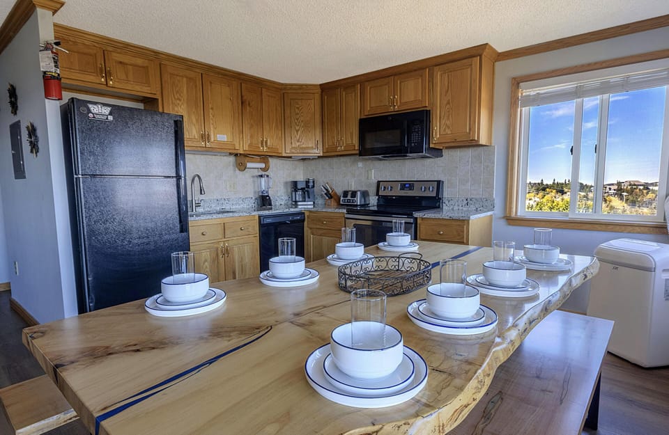Enjoy your meals in this gorgeous and roomy kitchen table that sits eight people.
