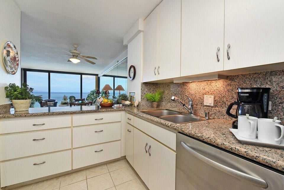 Fully equipped kitchen offering breathtaking ocean views while you cook your favorite meals