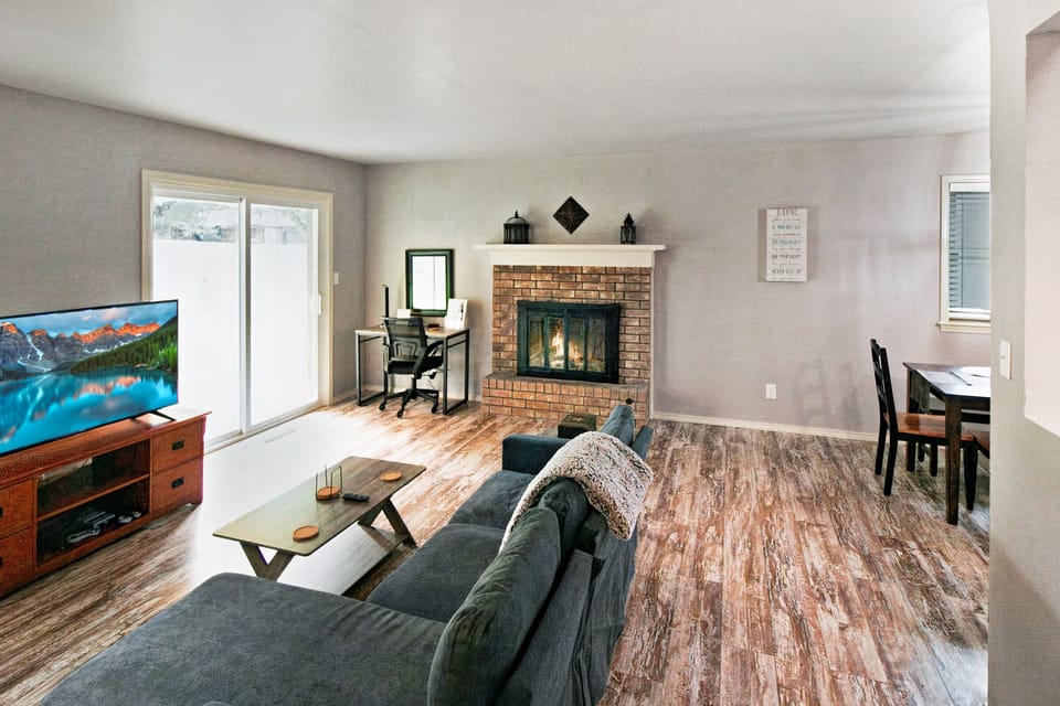 Living room has Smart TV and fireplace