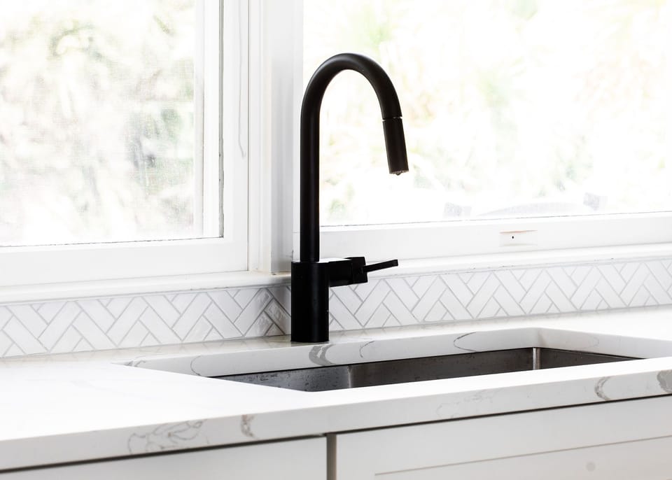 Sleek Kitchen Sink Area – Modern finishes and plenty of prep space.