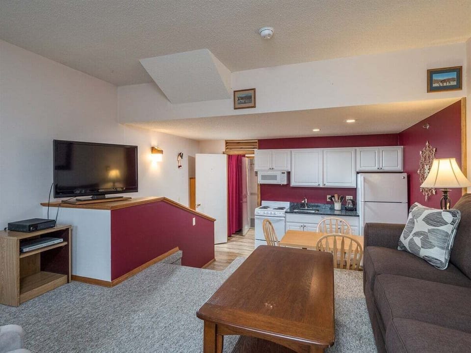 View of living, dining, and kitchen area