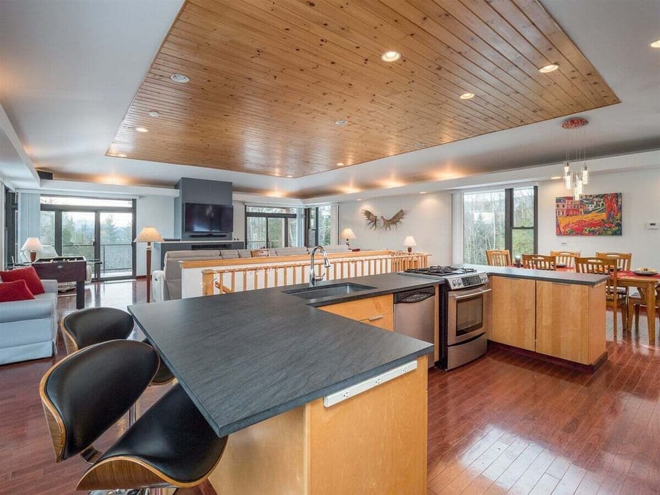 Overview of kitchen, dining, and living area
