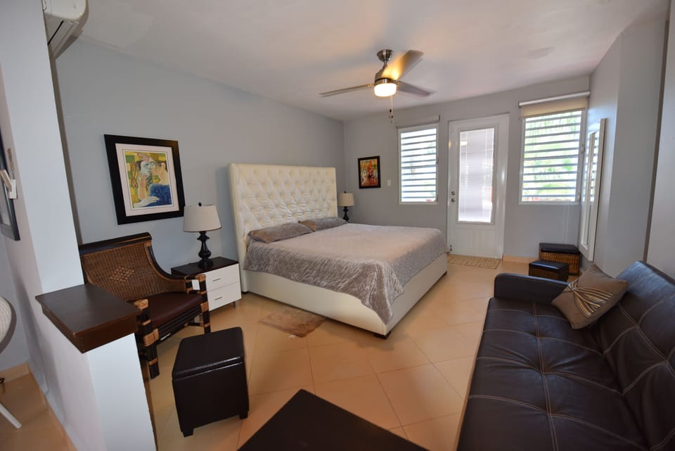 king size bed and a small futon bed
