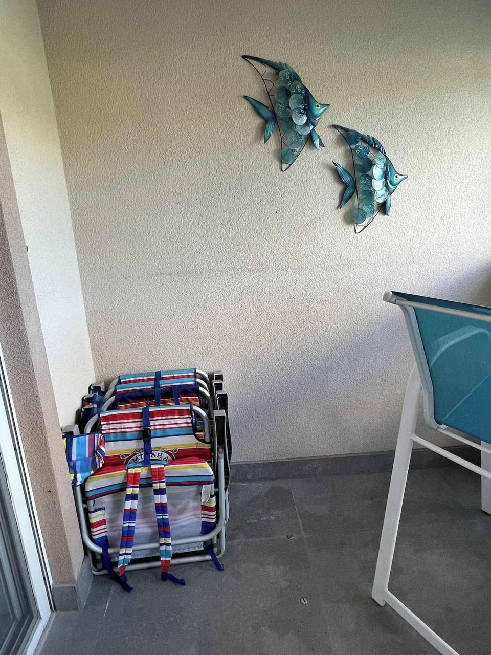 Balcony with Beach Chairs and Coolers.