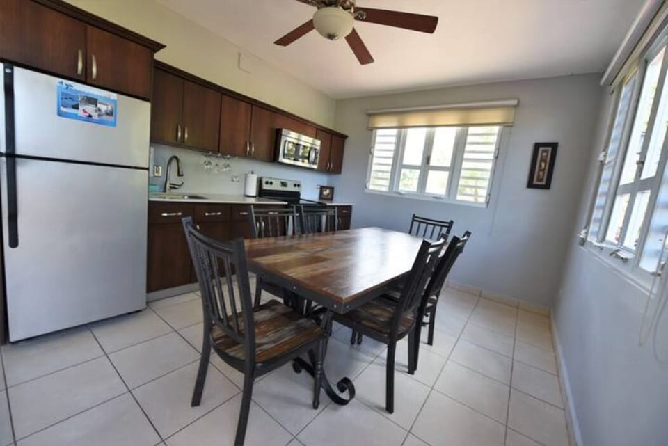 full kitchen with granite countertop, A/C and ceiling fans 