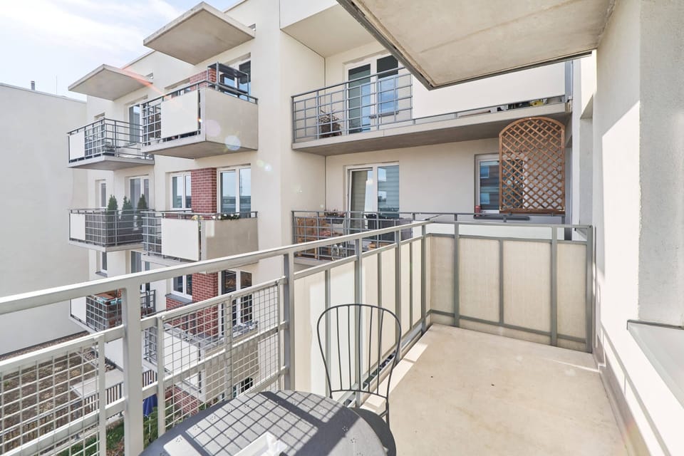 Balcony with garden furniture.