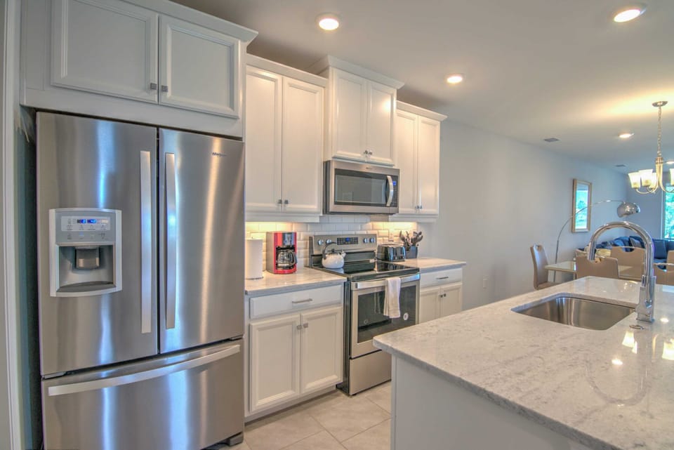 The Kitchen of the Villa is Very Clean and Well Appointed