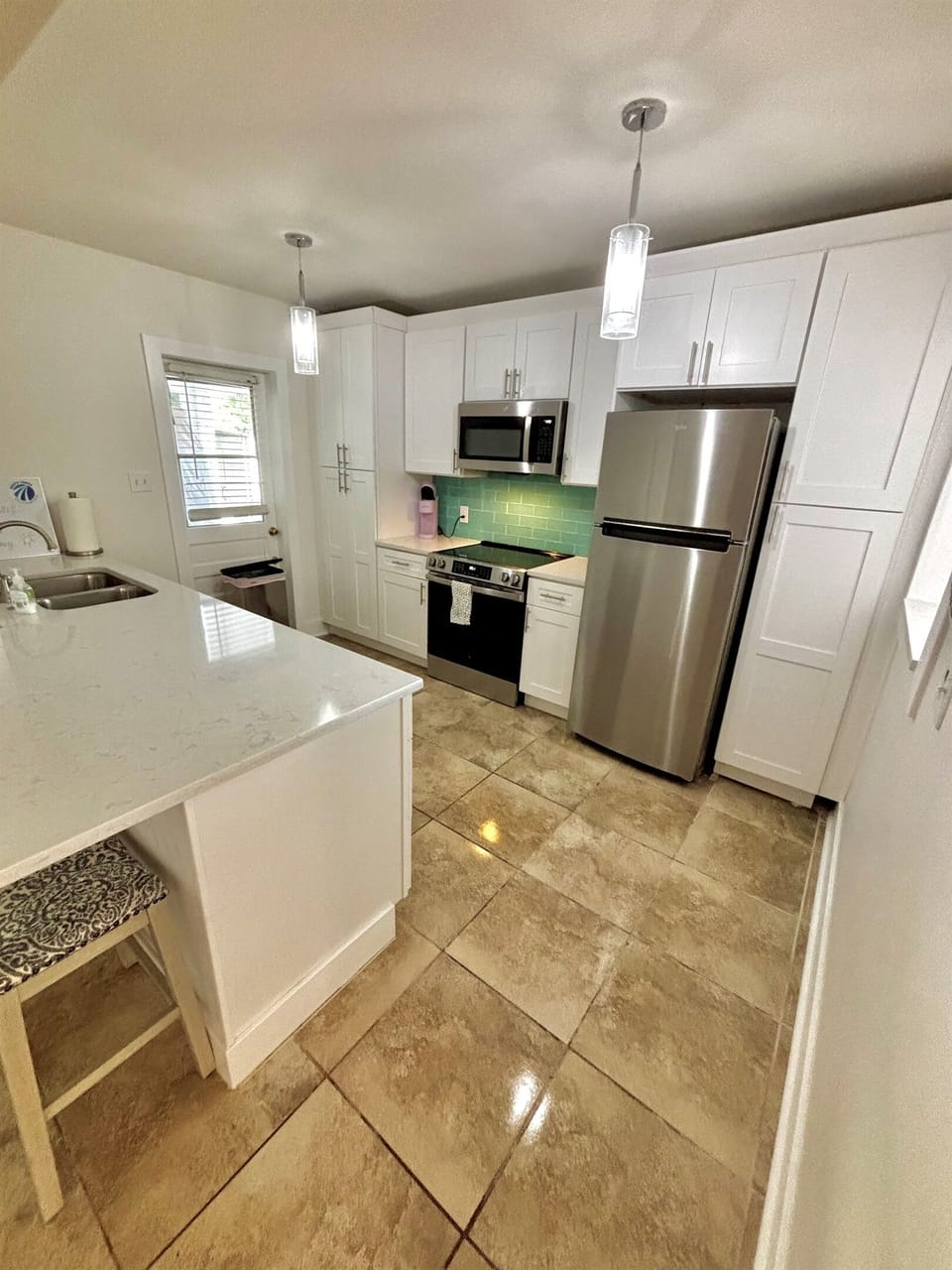 Enjoy your favorite meal in this beautifully updated full kitchen. Includes brand new stainless steel dishwasher, stove, oven, microwave and refrigerator. Drip & Keurig Coffee , plates, bowls, pots, pans, toaster, silverware, cups & spices included.