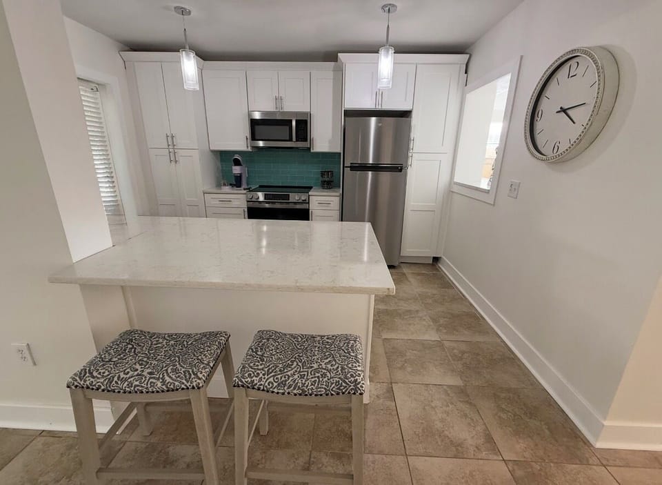 Fully stocked kitchen with everything you need for your inner Chef: Keurig and drip coffee maker, toaster, oven, refrigerator, stove, microwave, crockpot, pots, pans, all new stainless appliances, sugar, spices, and more!
