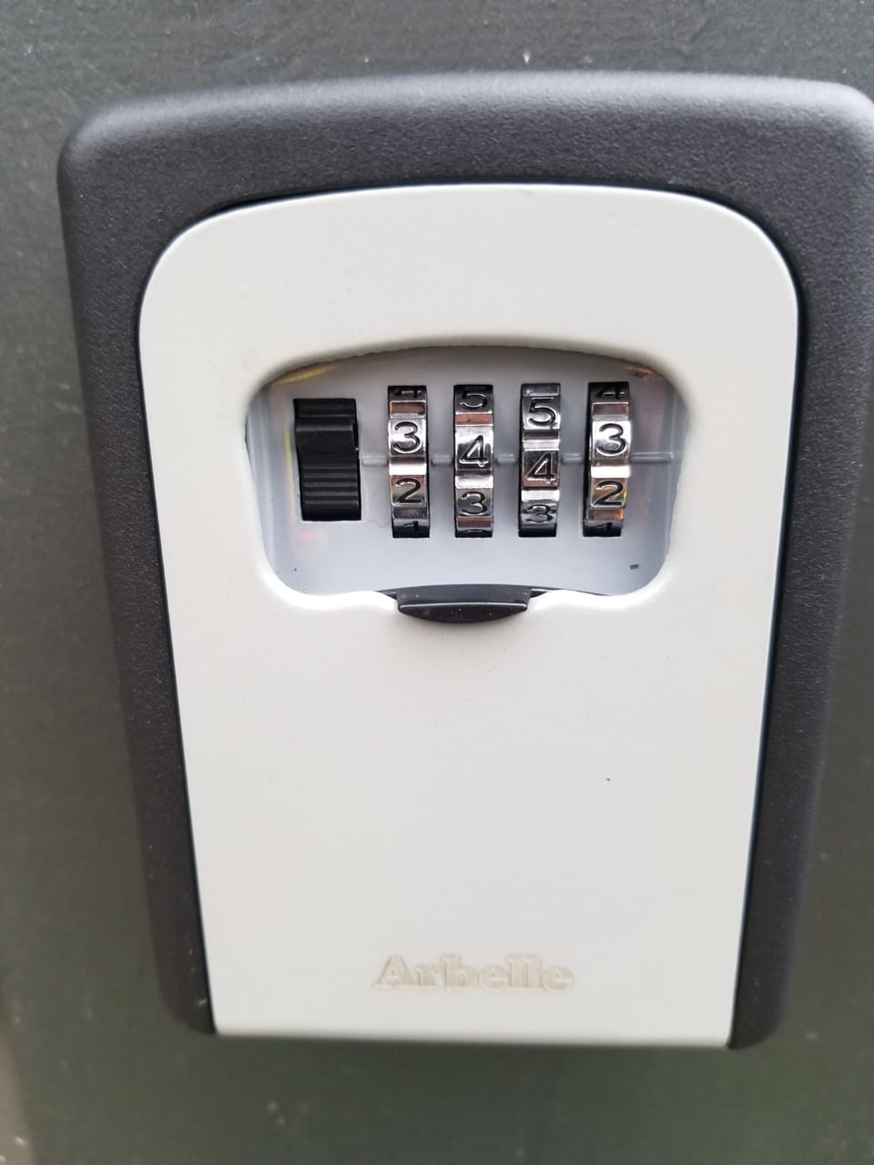 Pull door down, put in code in center window, pull black button down. for key.