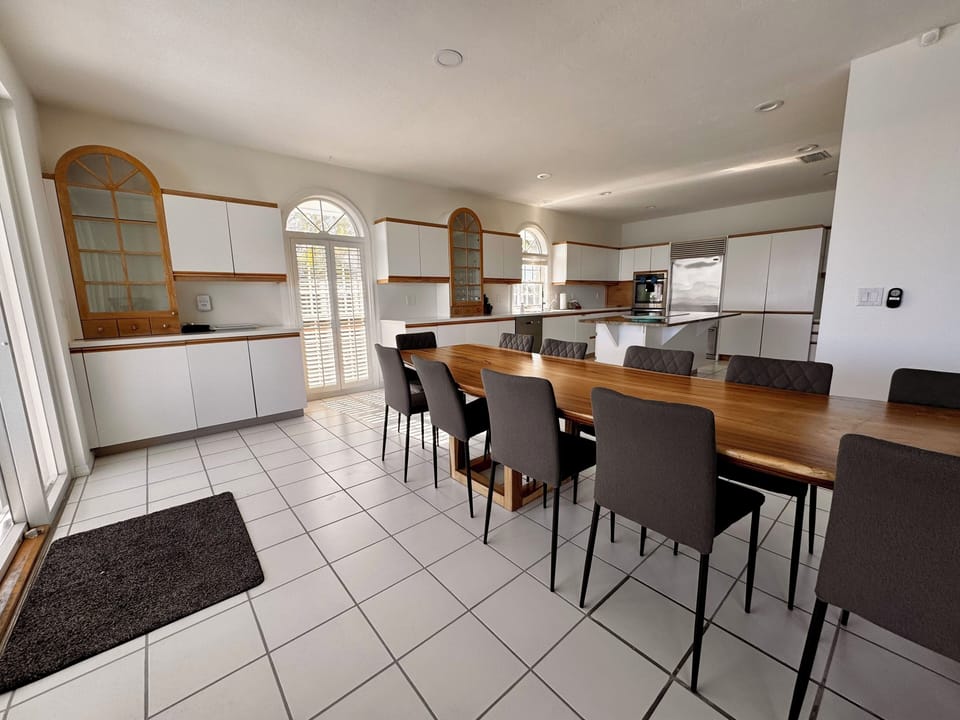Dining Room with Serving Station and profile view of the kitchen