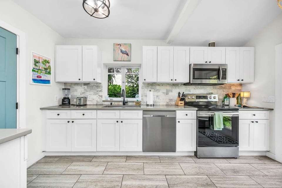 Amazing new kitchen with everything you need to cook up the perfect family meal! Stainless steel appliances, drip coffee maker, toaster, double fridge and direct access to the outdoors through the French doors.